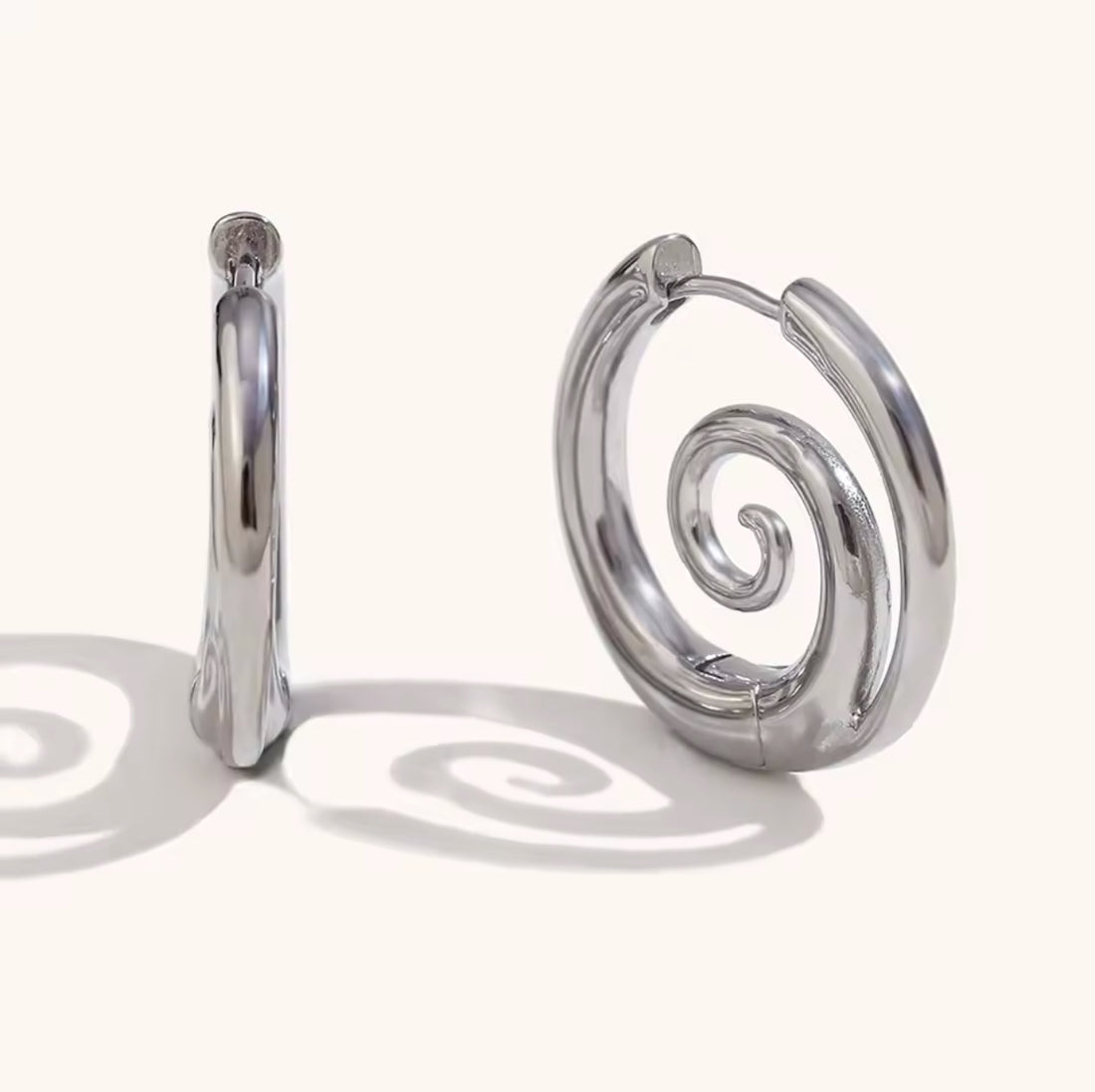 Swirl Stainless Steel Hoop Earrings - Premium Earrings from GRISE NYC - Just $56! Shop now at GRISÉ NYC